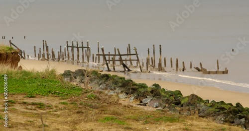 Wide shot of derelict sea defences at Happisburgh in March 2024. photo