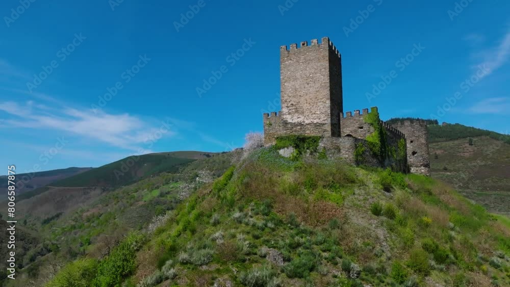 Castelo de Doiras - Medieval Fortress On Hill In Cervantes, Lugo, Spain. low angle, orbiting shot Castelo de Doiras - Medieval Fortress On Hill In Cervantes, Lugo, Spain. low angle, orbiting shot