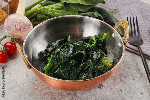 Coocked green spinach with oil photo