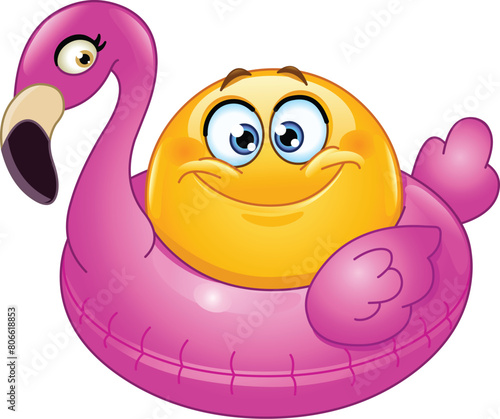 Happy emoji emoticon sitting in an inflatable pink flamingo ring