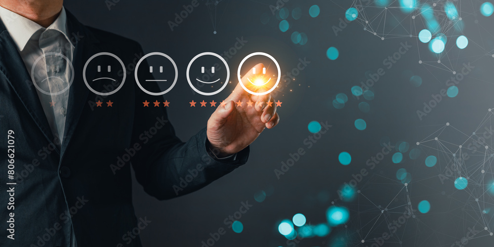 a businessman touching the virtual screen on the happy smile face icon to give satisfaction in service.rating very impressed.customer review service and Satisfaction concept a businessman touching the virtual screen on the happy smile face icon to give satisfaction in service.rating very impressed.customer review service and Satisfaction concept