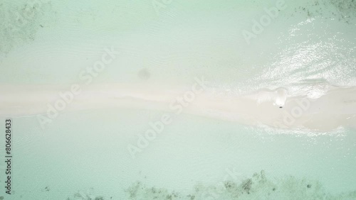 Cayo de agua in los roques with turquoise waters and white sands, ascending shot, aerial view photo