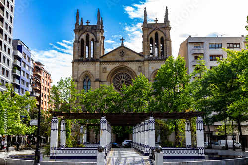 Pergola in the Begoña park and in the background the church of San Lorenzo from the late 19th century. Gijón, Asturias, Spain.