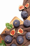 Fresh ripe figs on a cloth on a light background