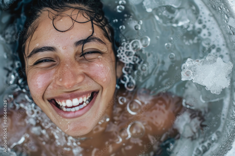 Portrait of a young woman enjoying a cold ice bath