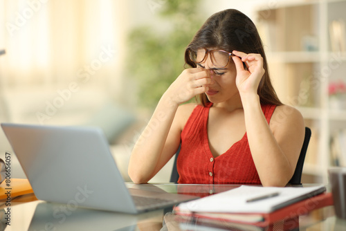 Bild auf Leinwand Student wearing eyeglasses suffering eyestrain