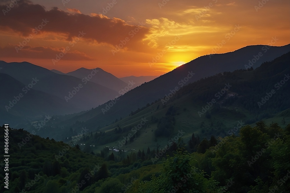 sunset over meadow and mountain