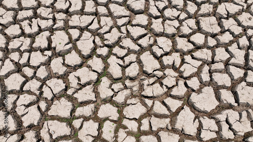 Witness the haunting beauty of a parched earth from above. This aerial drone captures the raw reality of drought, urging us to prioritize sustainable water management. 