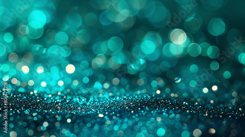 vibrant turquoise glitter with defocused twinkly lights in an abstract background.