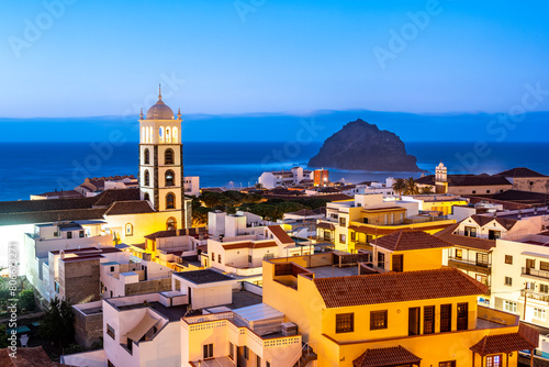 Spain, Canary Islands, Garachico, Town on coast of Tenerife island at dusk photo