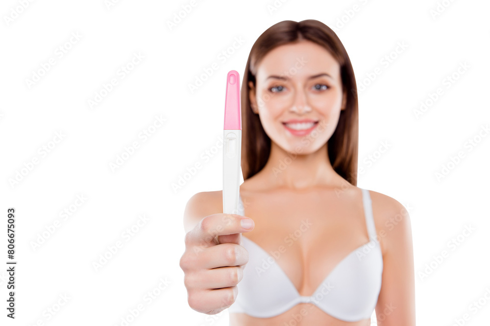 Motherhood parent mum parenthood concept. Close up photo of glad woman wearing white bra holding focused pink and white test isolated on blurred white background with copy-space Motherhood parent mum parenthood concept. Close up photo of glad woman wearing white bra holding focused pink and white test isolated on blurred white background with copy-space
