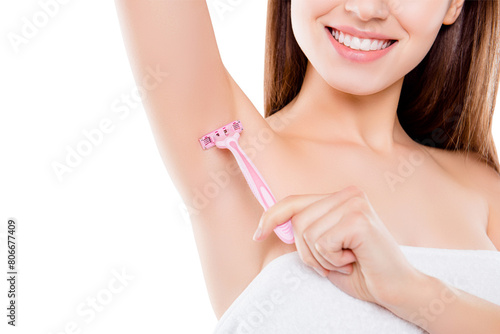 Cropped close up photo of beautiful attractive woman using pink shaver to remove unnecessary hair from armpits isolated on white background. Wellness wellbeing remover concept
