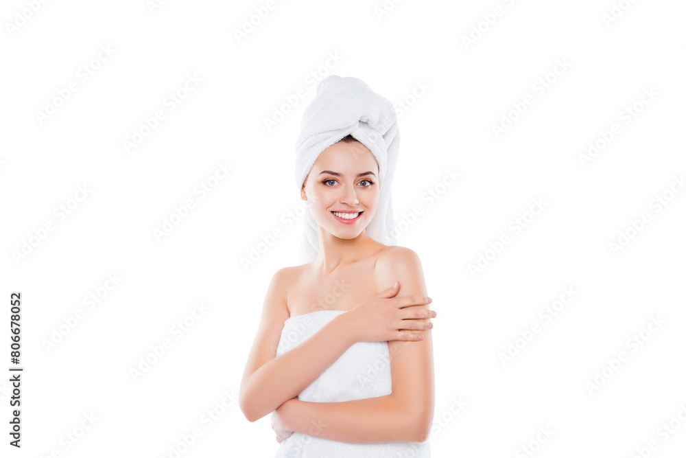 Portrait with copy space of pretty brunette girl with towel on head after shower touching enjoying soft skin looking at camera isolated over white background Portrait with copy space of pretty brunette girl with towel on head after shower touching enjoying soft skin looking at camera isolated over white background