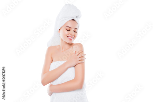 Portrait of charming sensual girl after shower with towel on head touching enjoying her perfect smooth skin with close eyes isolated on white background. Wellbeing harmony idyllic concept