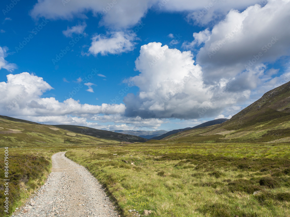 UK, Scotland, Clouds over empty dirt road in Cairngorm Mountains UK, Scotland, Clouds over empty dirt road in Cairngorm Mountains