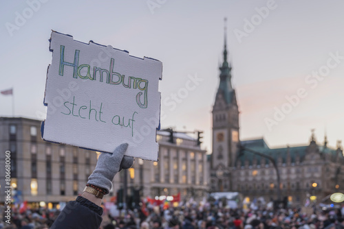 Germany, Hamburg,Crowd of people protesting in front of town hall photo
