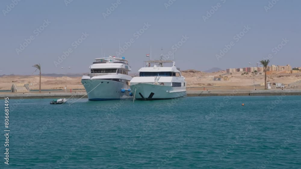 Modern Yachts Moored at Desert Marina, Contrasting Natural and Luxury Elements Modern Yachts Moored at Desert Marina, Contrasting Natural and Luxury Elements