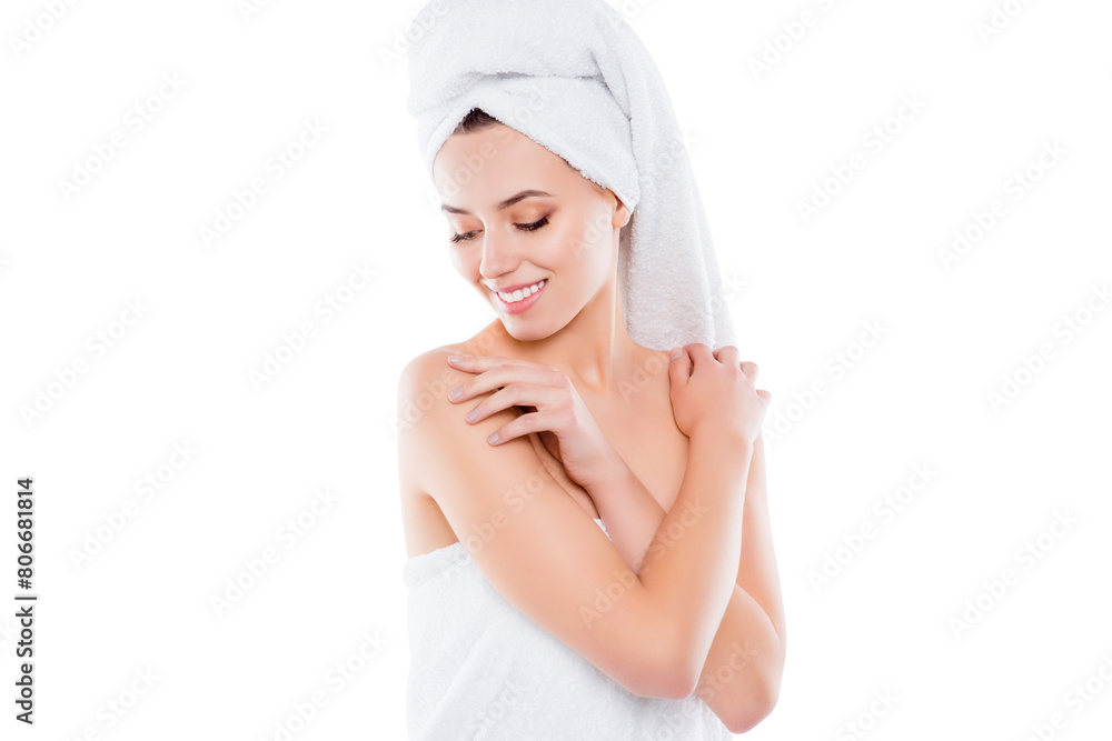Portrait of tender sensual girl after shower with turban on head touching enjoying perfect smooth skin with looking at body sisolated on white background Portrait of tender sensual girl after shower with turban on head touching enjoying perfect smooth skin with looking at body sisolated on white background