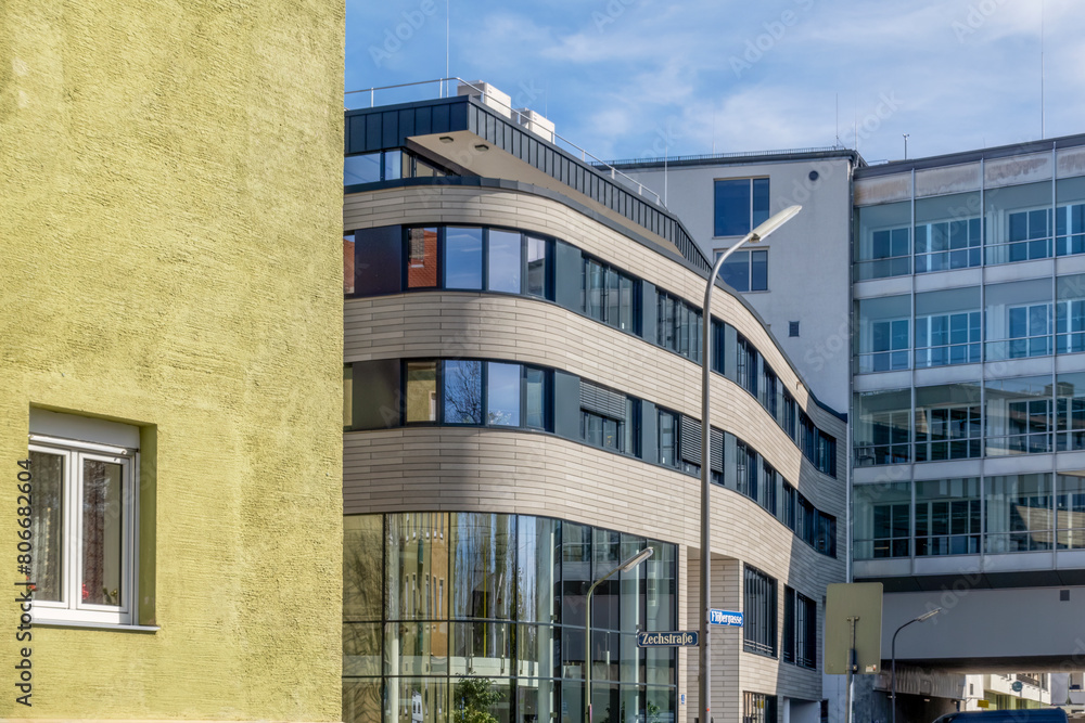 Germany, Bavaria, Munich, Glass facade of modern office building Germany, Bavaria, Munich, Glass facade of modern office building