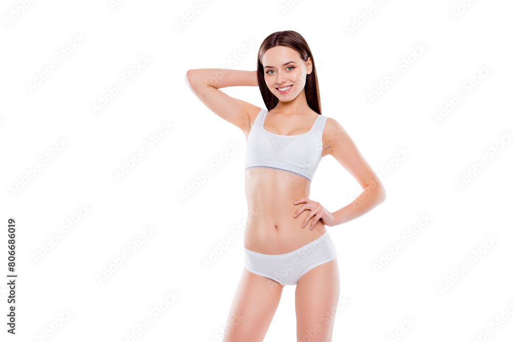 Portrait of fit slender woman with perfect body in white cotton underwear bikini posing looking at camera isolated on white background Portrait of fit slender woman with perfect body in white cotton underwear bikini posing looking at camera isolated on white background