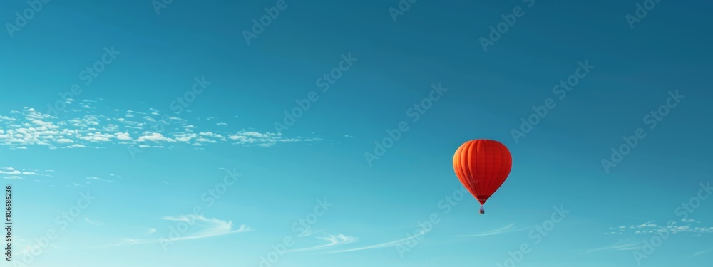 Obraz premium A clear blue sky with a single hot air balloon floating peacefully.