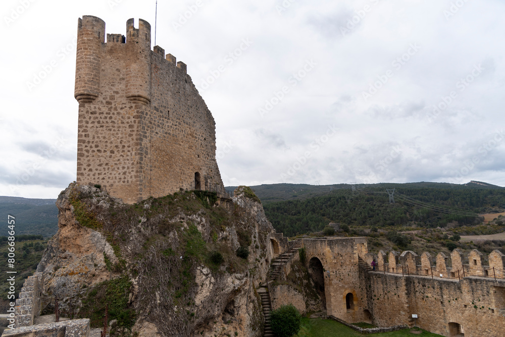 Panoramic view of the ruined tower of the medieval castle in the tourist town of Frías in the province of Burgos on a cloudy day. Panoramic view of the ruined tower of the medieval castle in the tourist town of Frías in the province of Burgos on a cloudy day.