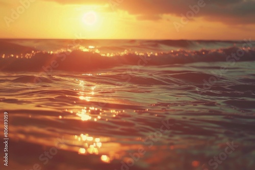 Golden sunset reflecting on rippling ocean waves