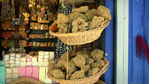 Baskets with lots of Greek bathing sponge (Spongia officinalis) on the wall of a small private shop in the Greek bazaar. photo