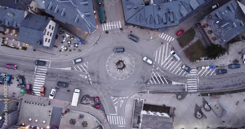 Ascending overhead view of a traffic circle in the town of Benasque in the province of Huesca, Aragon, Spain. Low vehicular traffic photo