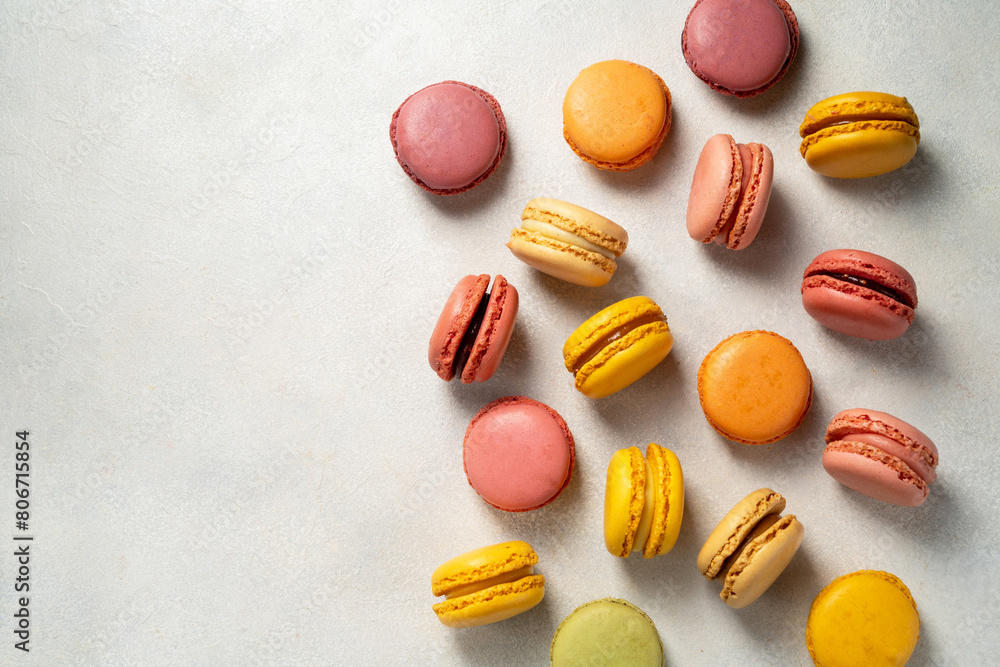 Colorful yellow, pink Macrons, top view, copy space, Sweet dessert, sugar Colorful yellow, pink Macrons, top view, copy space, Sweet dessert, sugar