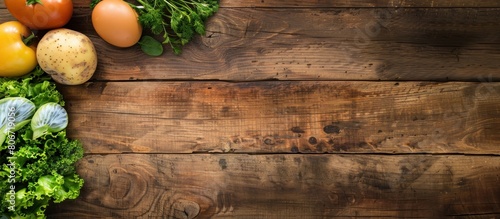 Various kinds of healthy food from vegetables, fruit and meat on a wooden table background