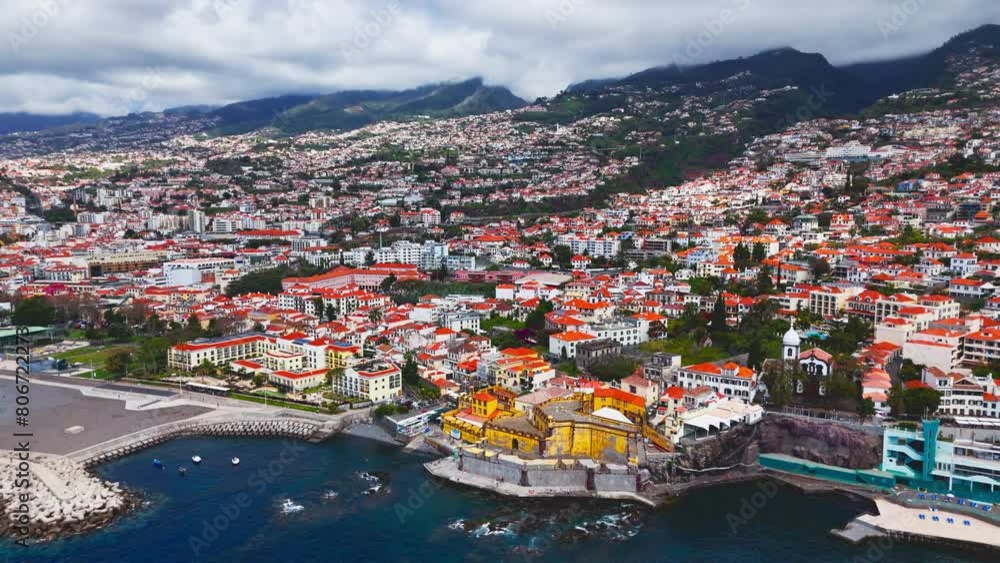 Aerial view cityscape town Funchal on the coast and mountains around city on Madeira island Aerial view cityscape town Funchal on the coast and mountains around city on Madeira island