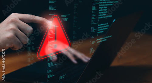 Programmer developer, staff businessman using computer laptop programming access security caution warning triangle sign, issued ungranted access online internet cybercrime.