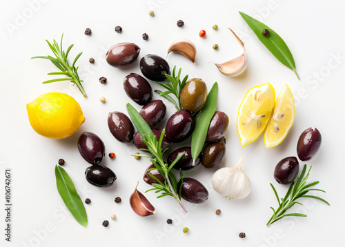 Top view of a bowl of kalamata olives garnished with fresh herbs, surrounded by ingredients photo