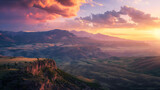 A majestic sunrise over a remote mountain range, painting the sky with hues of pink and gold, while casting long shadows across the rugged landscape below, creating a dramatic and awe-inspiring scene