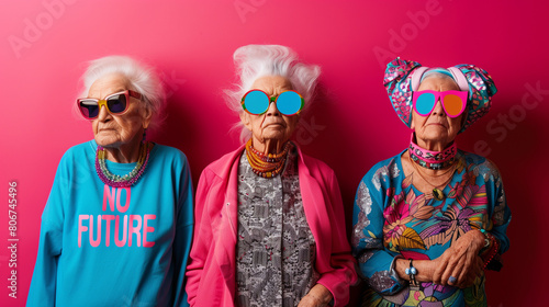 three ederly women posing in colorful clothes, eternal youth concept