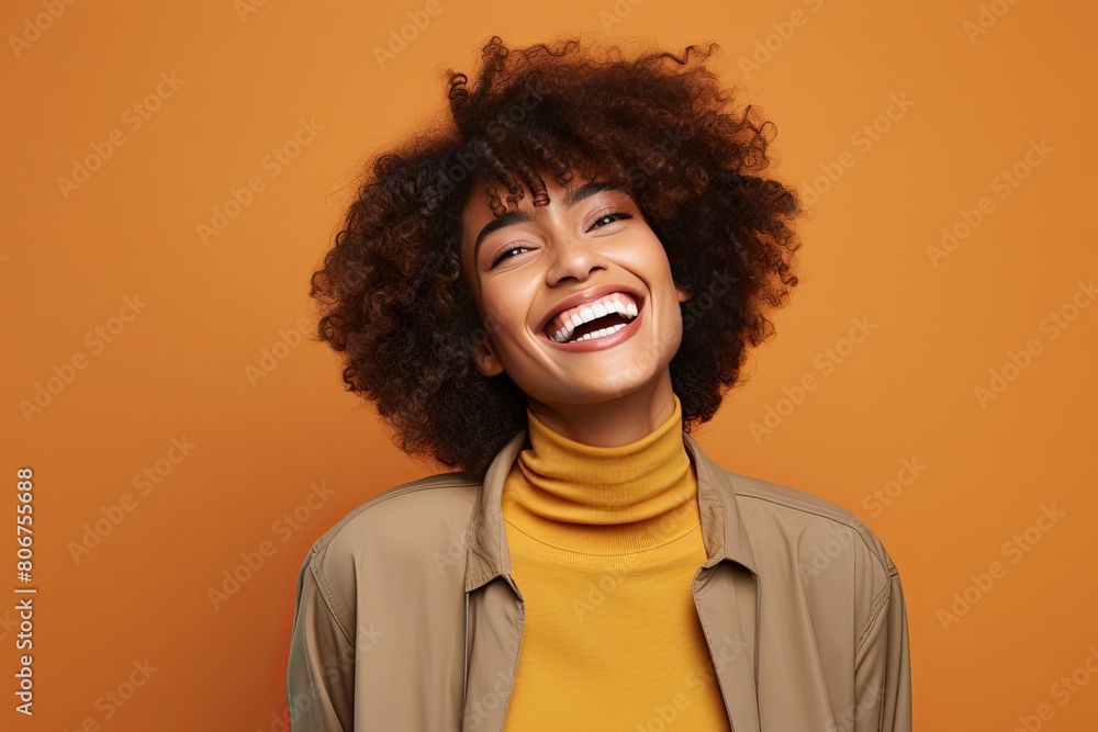 Beautiful black woman smiling and having in studio shot. Beautiful black woman smiling and having in studio shot.