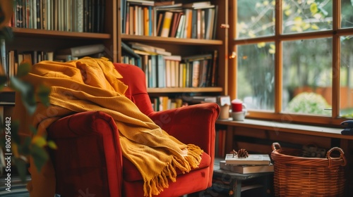 Yellow throw blankets on red armchairs in a cozy reading nook.
