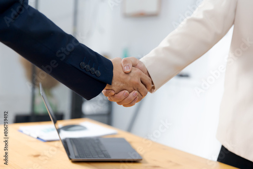Businessmen handshaking on agreement and successful teamwork skill, working in his office planning strategy, creative thinking and innovation ideas, professional leadership business worker.