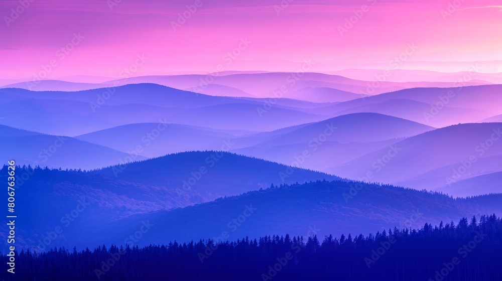   A mountain range view with trees in foreground, pink sky behind, blue hue ahead