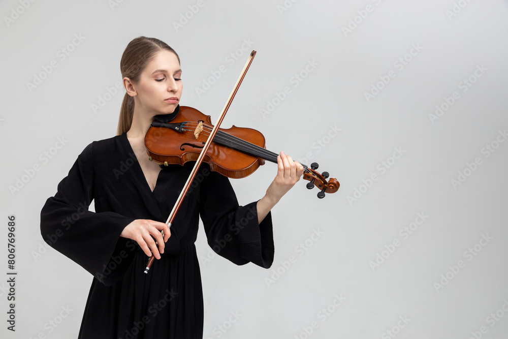 Woman musical artist playing violin Woman musical artist playing violin