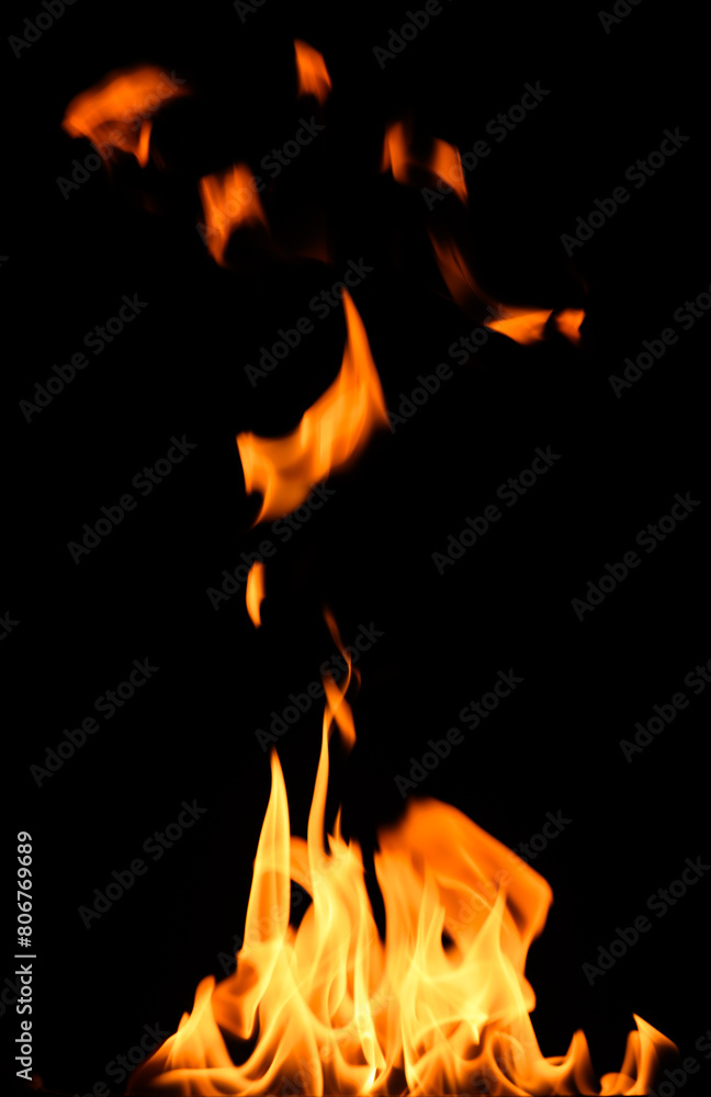 fire on a black background, burning and hot flames, close view fire on a black background, burning and hot flames, close view