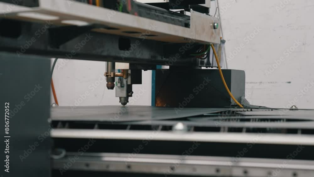 The fiber laser cutting machine cutting machine cut the metal plate. High quality 4k footage The fiber laser cutting machine cutting machine cut the metal plate. High quality 4k footage