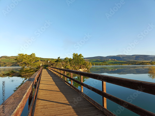 Fototapeta Naklejka Na Ścianę i Meble -  bridge leading to the island of the lake: Alloz, province of Navarra Spain