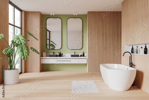 Wooden and mint bathroom interior with tub and double sink