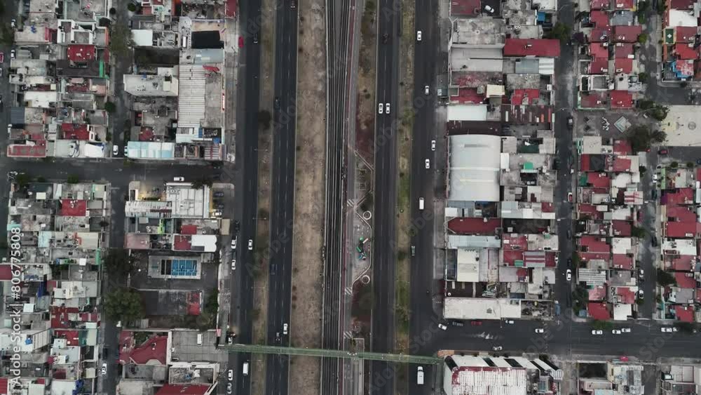 Aerial view of Avenida Central on a clear day in the streets of Ecatepec. Slow motion Aerial view of Avenida Central on a clear day in the streets of Ecatepec. Slow motion