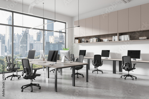 Business office interior with coworking zone with shelf, panoramic window photo