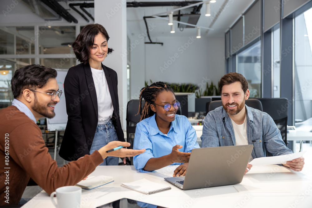Office employees people discussing risky ideas working on laptop in office Office employees people discussing risky ideas working on laptop in office