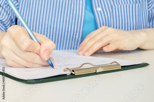 fill out documents, a woman writes on forms, employment contract, HR manager, insurance paperwork, client service