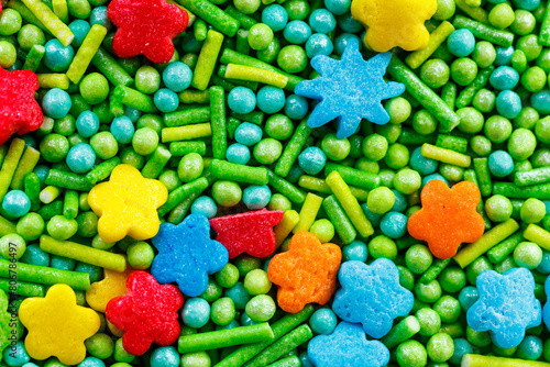 The texture of candy sprinkles.Varied sugar sprinkles, stars, flowers, dots.Holiday treat.Toppings for donuts,cupcake, desserts and ice cream .